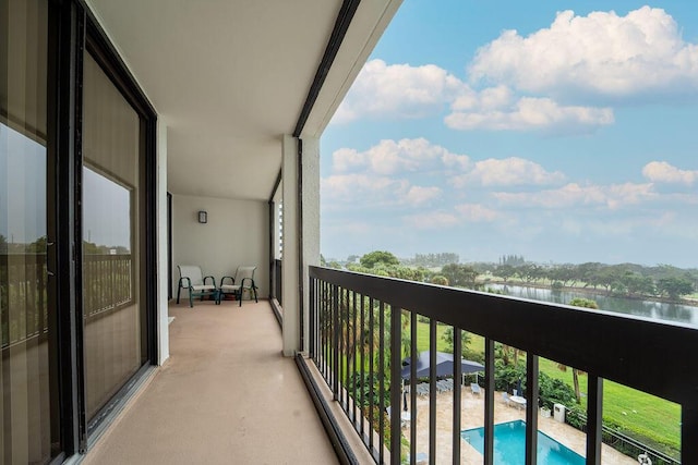 balcony featuring a water view