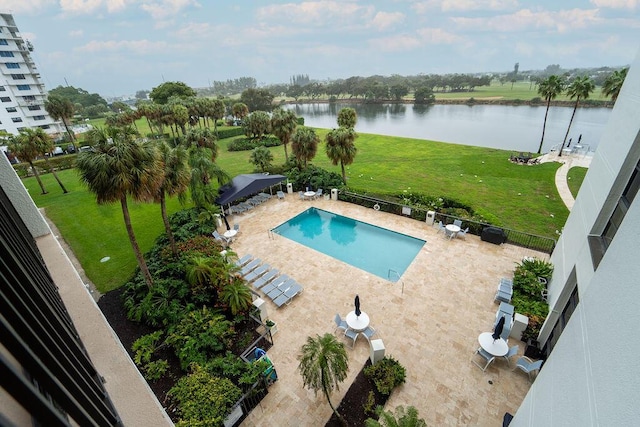 view of pool with a gazebo, a patio area, and a water view