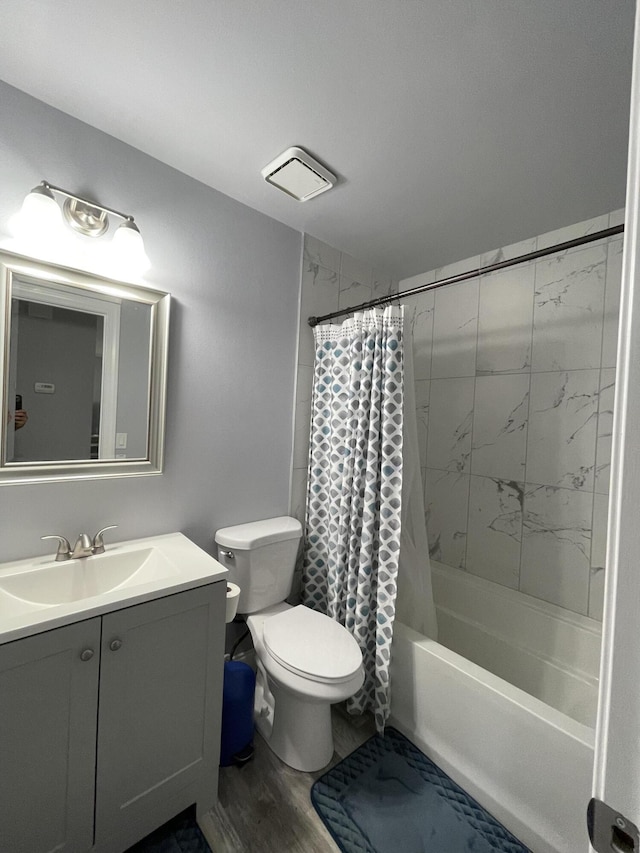 full bathroom with vanity, toilet, hardwood / wood-style floors, and shower / tub combo with curtain