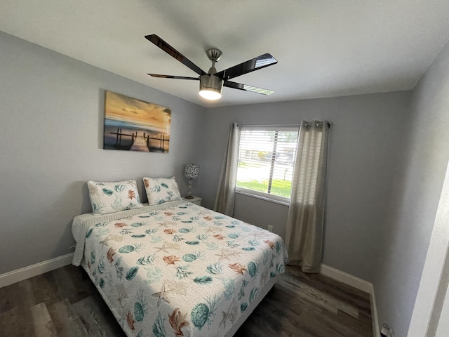 bedroom featuring ceiling fan and dark hardwood / wood-style flooring