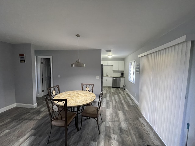 dining area with dark wood-type flooring