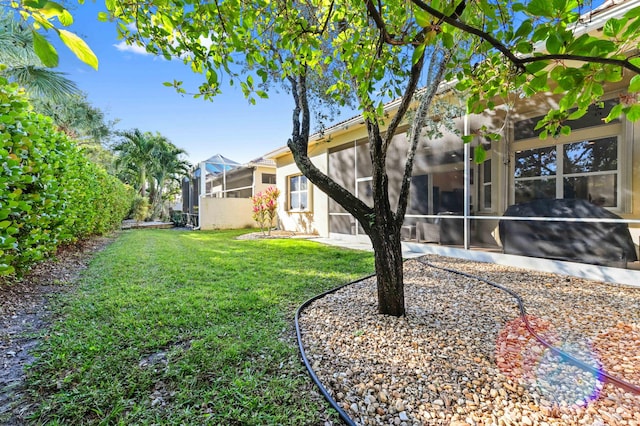 view of yard featuring a lanai