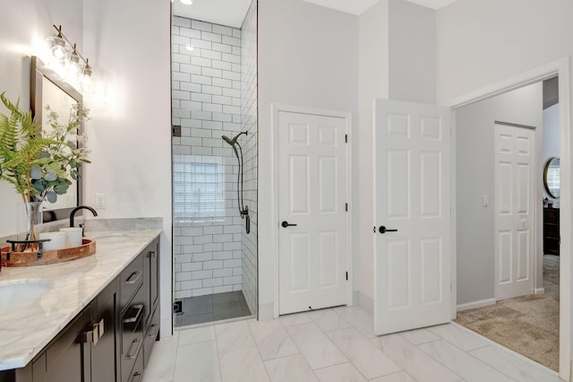 bathroom with vanity and a shower with door