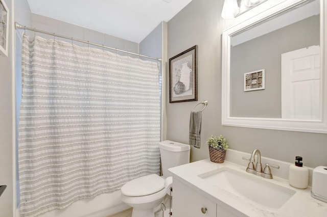 full bathroom featuring vanity, shower / bath combo, and toilet