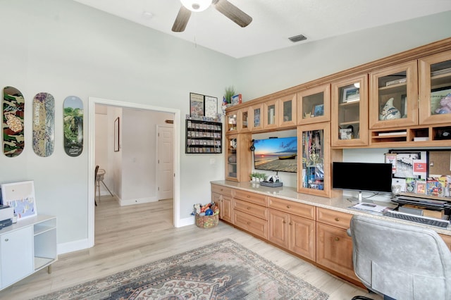 office area with ceiling fan, lofted ceiling, and light hardwood / wood-style flooring