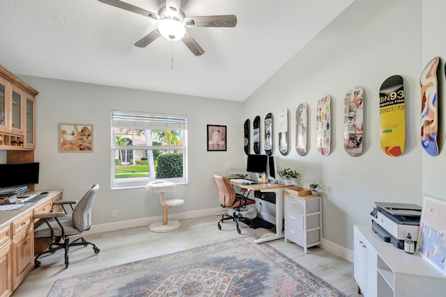 office with light hardwood / wood-style flooring and ceiling fan