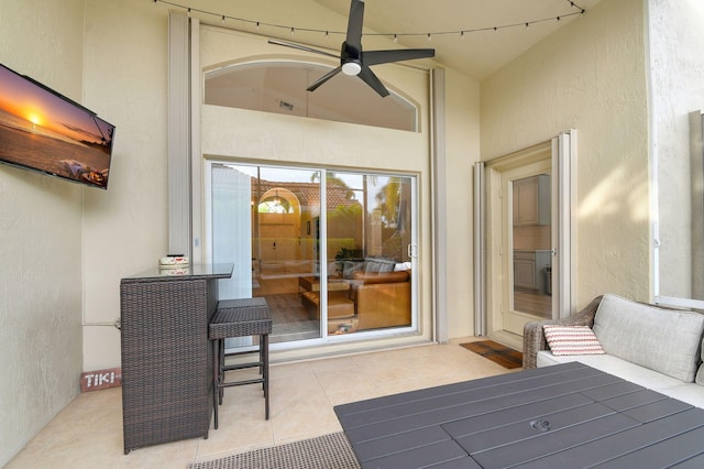 exterior space with ceiling fan