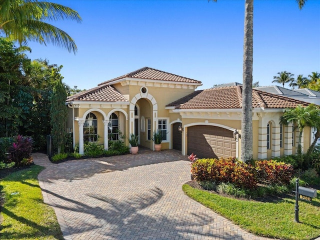 6380 Dorsay Ct, Delray Beach, FL 33484 - mediterranean / spanish-style home with a garage