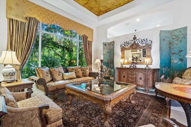 sitting room featuring a raised ceiling