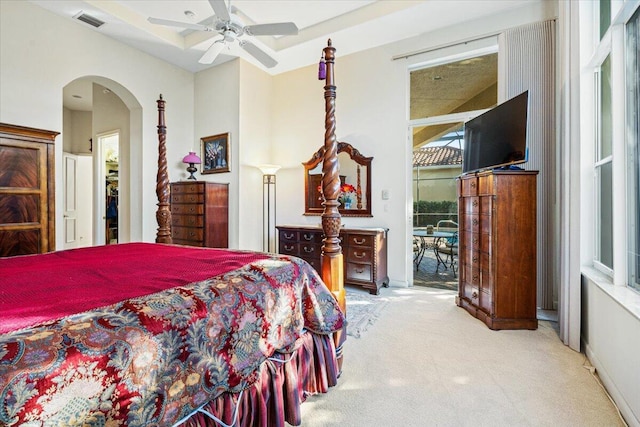 bedroom featuring light carpet, access to exterior, and ceiling fan