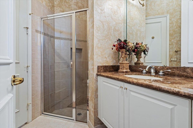 bathroom featuring an enclosed shower and vanity