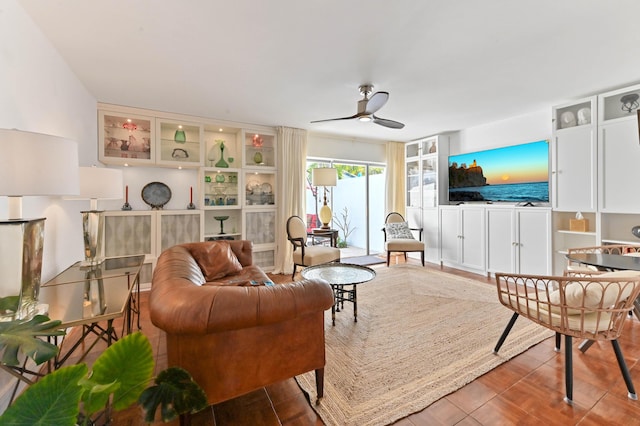 living room featuring hardwood / wood-style flooring and ceiling fan