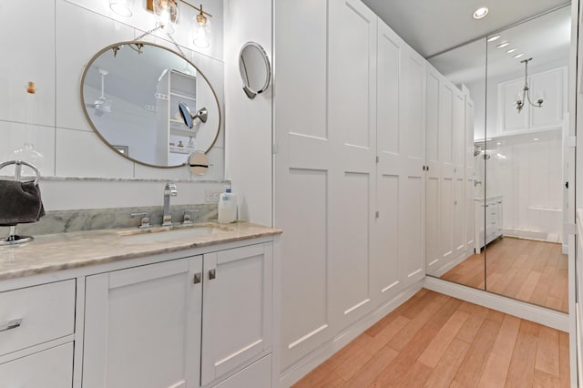 bathroom with vanity and hardwood / wood-style flooring