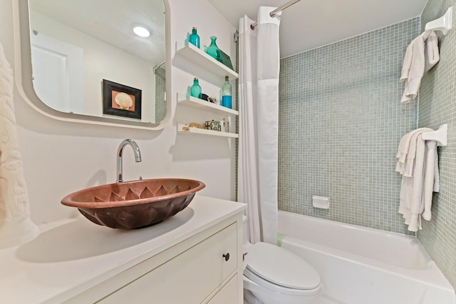 full bathroom featuring vanity, toilet, and shower / bath combo with shower curtain