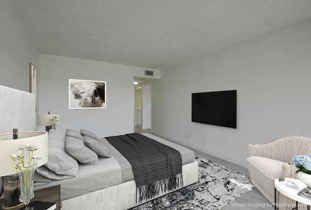 bedroom featuring a textured ceiling