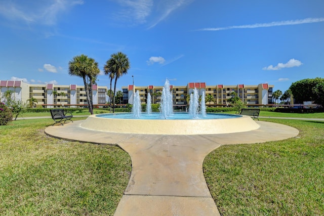 view of community featuring a lawn