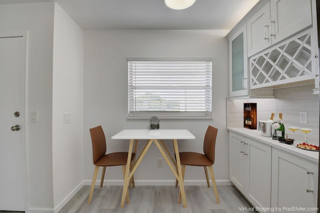 dining area with light hardwood / wood-style floors