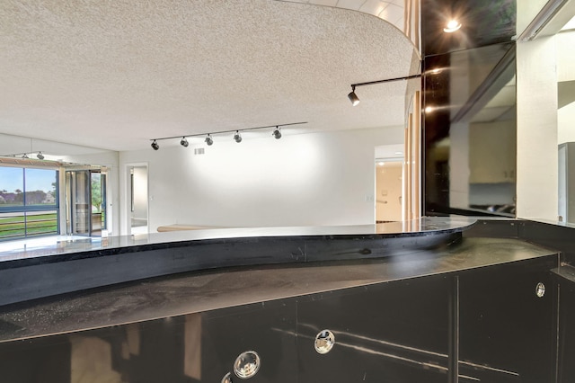 5519 Fairway Park Dr Unit 202, Boynton Beach, FL 33437 - bathroom with a textured ceiling and rail lighting