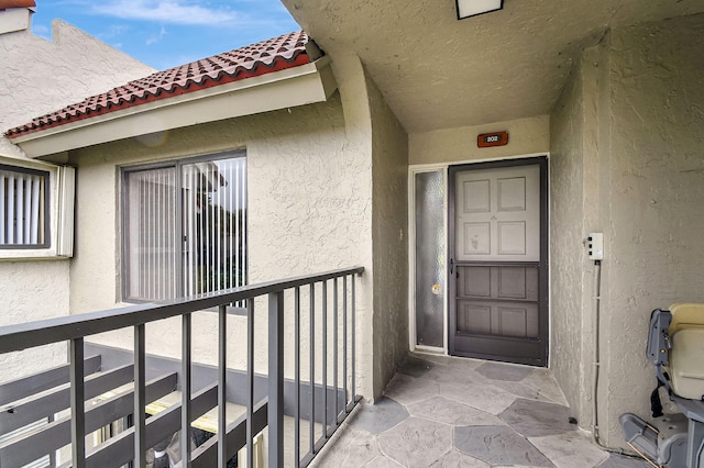 5519 Fairway Park Dr Unit 202, Boynton Beach, FL 33437 - entrance to property with a tile roof and stucco siding