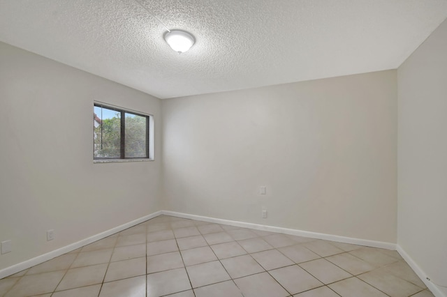 5519 Fairway Park Dr Unit 202, Boynton Beach, FL 33437 - empty room featuring a textured ceiling and baseboards