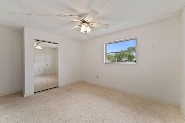 unfurnished bedroom with a closet, ceiling fan, and a textured ceiling