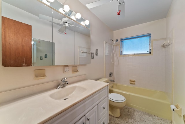 full bathroom with vanity, toilet, ceiling fan, and tiled shower / bath combo