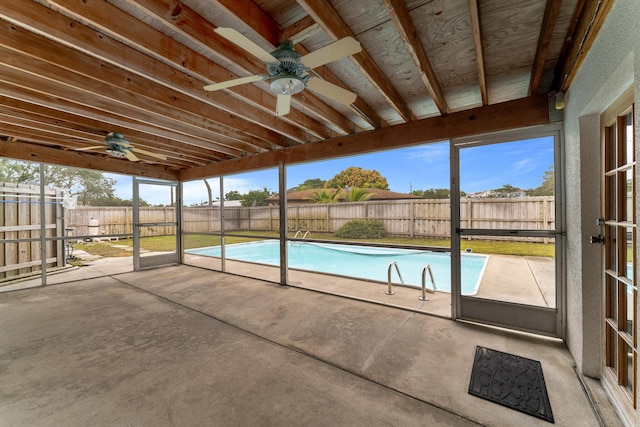 view of pool with ceiling fan and a patio