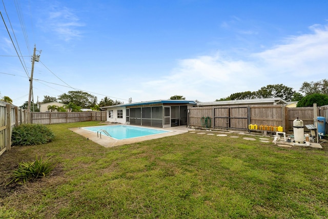 view of swimming pool with a sunroom and a lawn