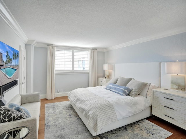 bedroom featuring crown molding, dark hardwood / wood-style floors, and a textured ceiling