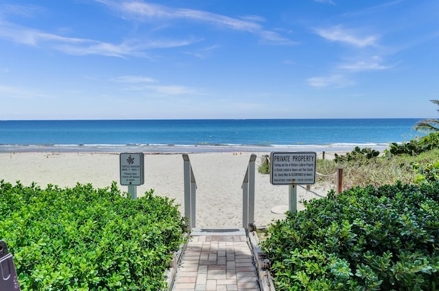 property view of water featuring a beach view