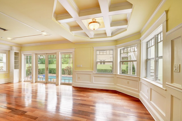 unfurnished sunroom with french doors, beamed ceiling, and coffered ceiling