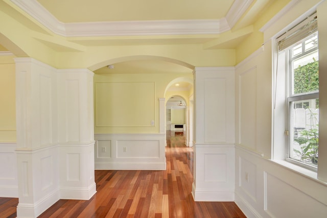 hallway with crown molding and hardwood / wood-style flooring