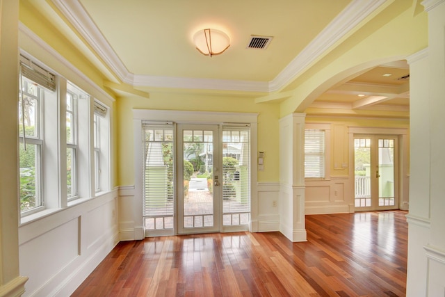 doorway to outside featuring french doors, crown molding, and a wealth of natural light