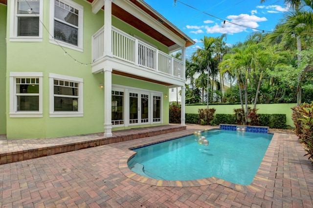 view of swimming pool with a patio area