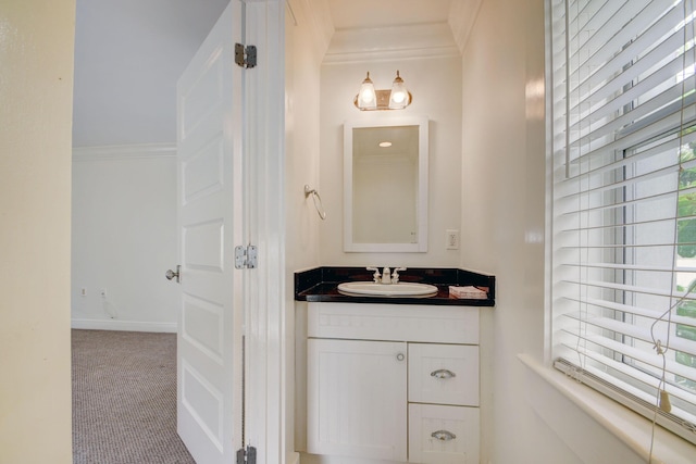 bathroom featuring crown molding and vanity