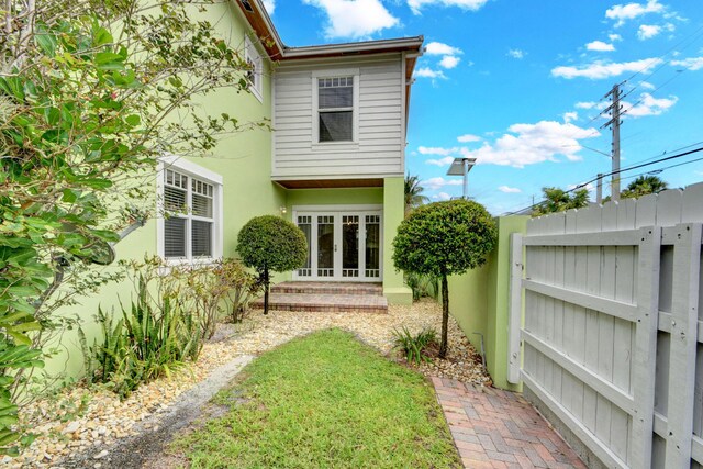 rear view of property featuring french doors