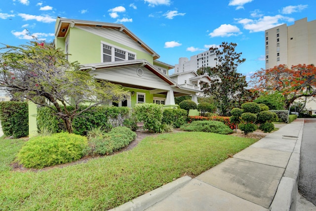 view of home's exterior with a lawn