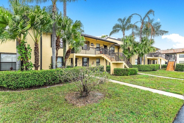 view of front of home with a front lawn