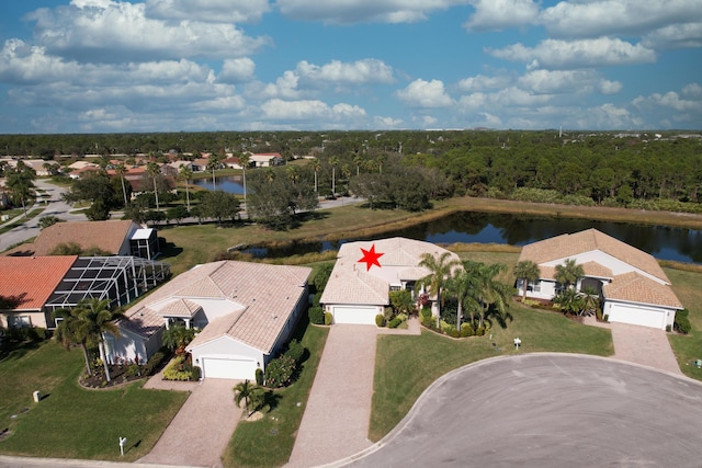 birds eye view of property with a water view