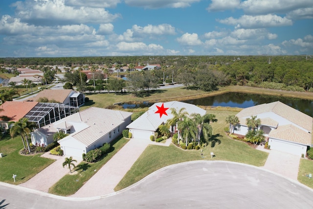 birds eye view of property with a water view