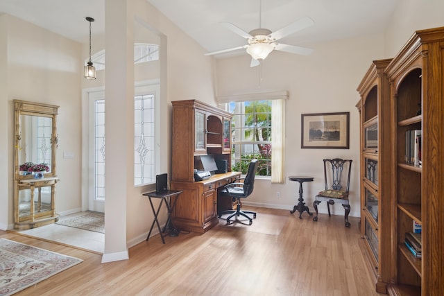 office featuring light hardwood / wood-style floors and ceiling fan