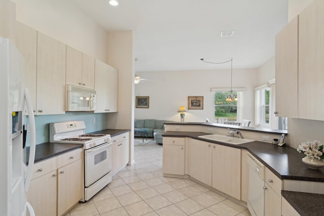 kitchen featuring decorative light fixtures, sink, light tile patterned floors, ceiling fan, and white appliances