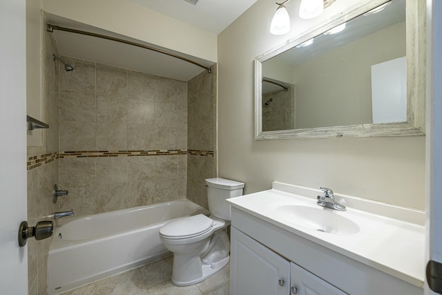 full bathroom with vanity, tile patterned flooring, tiled shower / bath combo, and toilet