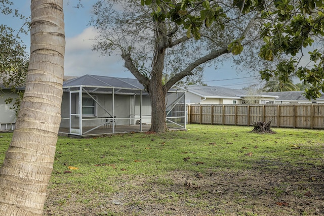 view of yard featuring a lanai