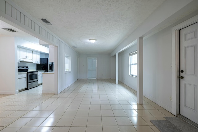 interior space with a textured ceiling