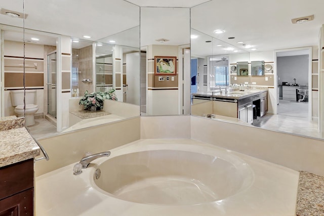 full bathroom with independent shower and bath, vanity, tile patterned floors, and toilet