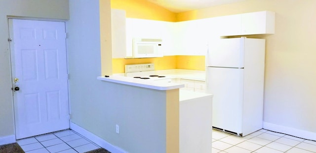 kitchen featuring white cabinets, white appliances, kitchen peninsula, and light tile patterned floors