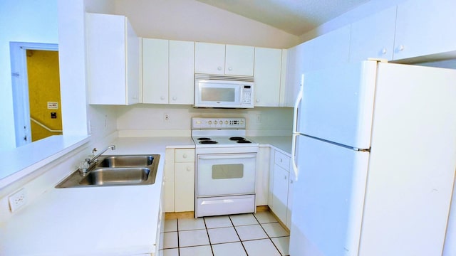 kitchen with white appliances, white cabinetry, light tile patterned floors, sink, and lofted ceiling