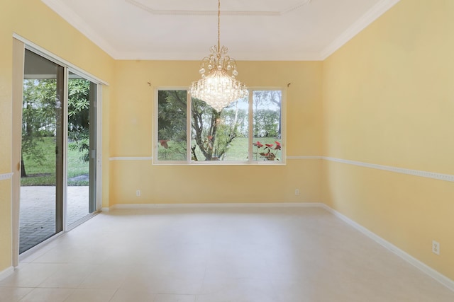 spare room featuring an inviting chandelier, ornamental molding, and a healthy amount of sunlight