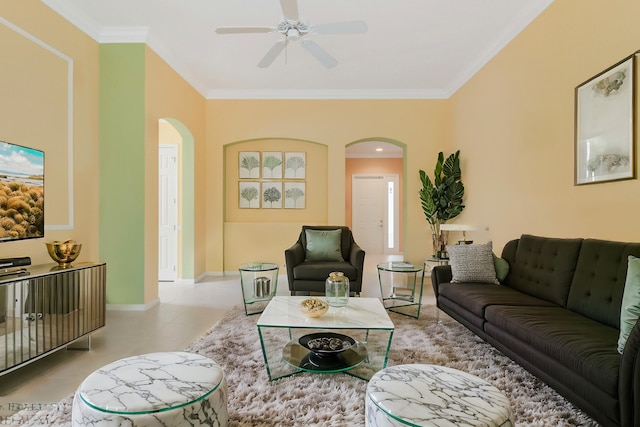 living room with crown molding and ceiling fan